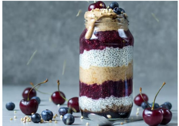 Coconut Chia Pudding with layered Berries and  Almond  Butter